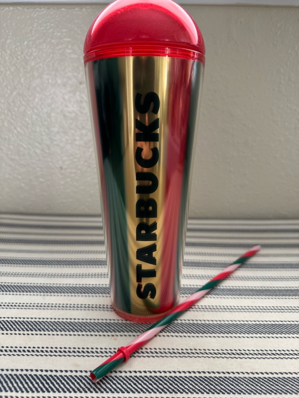 Starbucks Gold Tumbler with Red Dome Lid and Striped Straw